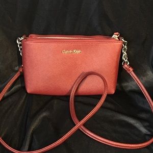 Leather burgundy crossbody chain purse.